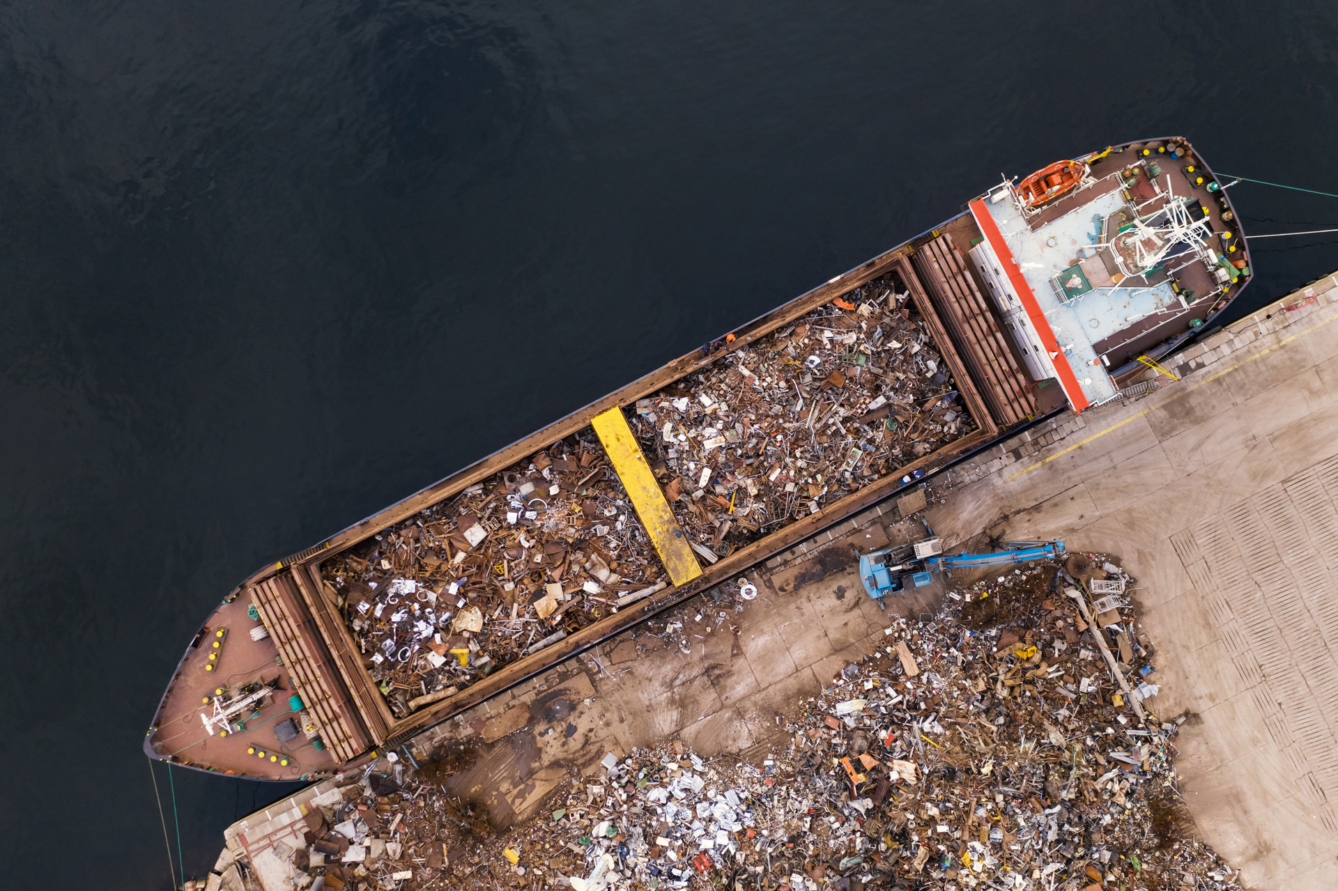 Aerial view of scrap metal loaded onto a ship