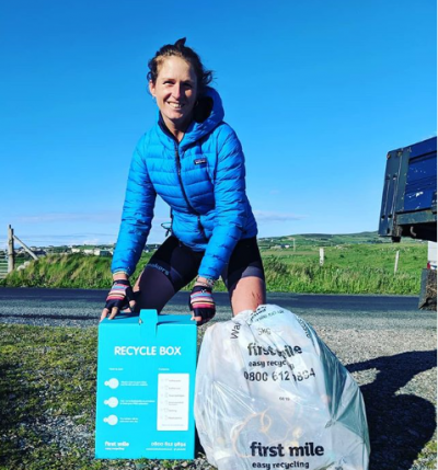 Kiko Matthews collecting beach litter during her cycling challenge