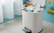 Toothpaste tube in a bathroom bin
