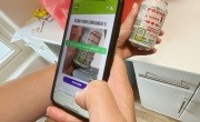 Someone scanning a QR code on side of a can in the Brecon digital deposit return scheme trial