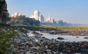Waste debris, including food waste, with the Taj Mahal  in the background