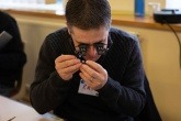 A volunteer fixing an item at a repair café