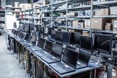 Laptops and computer screens lined up