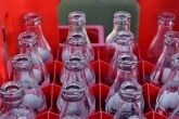 Empty glass bottles in a red crate