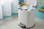 Toothpaste tube in a bathroom bin