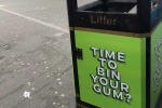 A poster encouraging the public to put gum in the bin