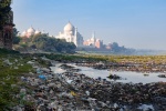 Waste debris, including food waste, with the Taj Mahal  in the background