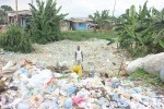 Man in sea of plastic pollution