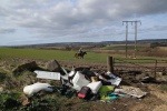 Waste cowboy fly-tipping in rural area