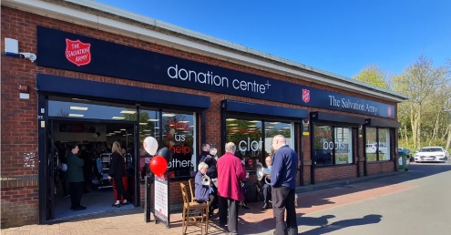 Exterior shot of people outside a Salvation Army donation centre