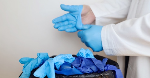 Surgical gloves being discarded