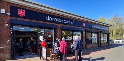 Exterior shot of people outside a Salvation Army donation centre